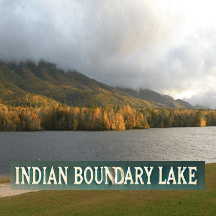 A scenic autumn view of Indian Boundary Lake with mountains and fall foliage in the background, and the text "Indian Boundary Lake" at the bottom.